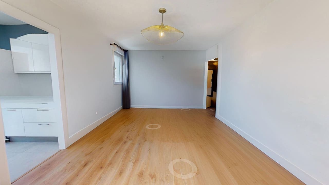 Appartement T2 de 47 m² avec terrasse et garage face à la Nouvelle Mairie — pièce démeublée par home staging virtuel